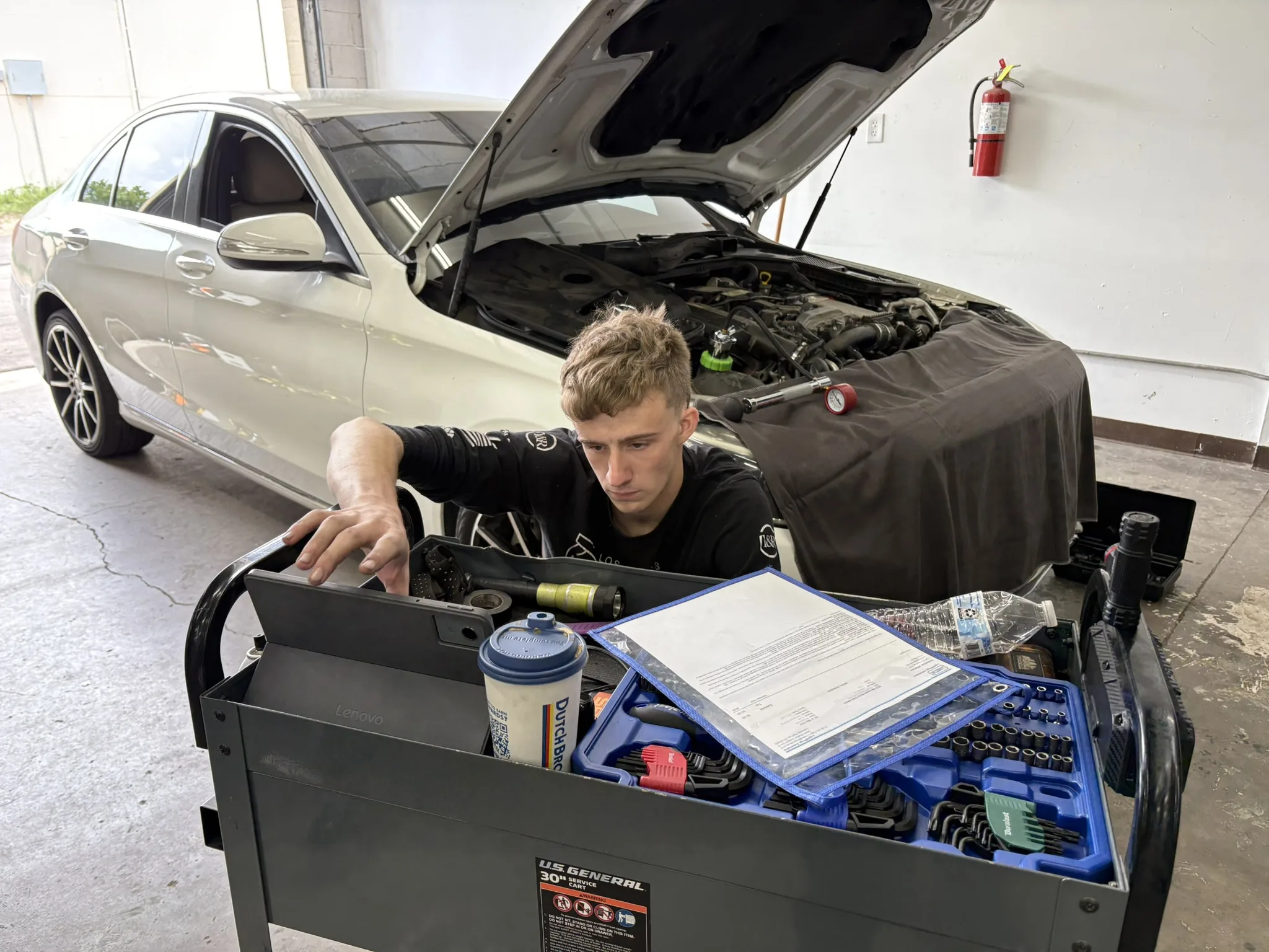 Technician verifying findings before advising